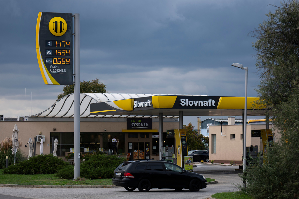 A car enters a Slovak gas station called Slovnaft, which is owned by MOL, Hungary's national oil and gas conglomerate, near Sturovo, Slovakia, on Sept. 28, 2025. (AP Photo/Denes Erdos)
