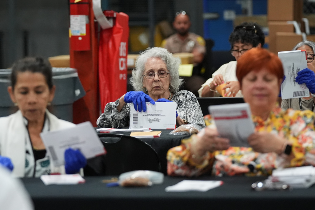 Election workers sort vote-by-mail ballots at the Miami-Dade County Supervisor of Elections Office for the Florida primary election in Doral, Fla., Tuesday, Aug. 18, 2026. (AP Photo/Lynne Sladky)