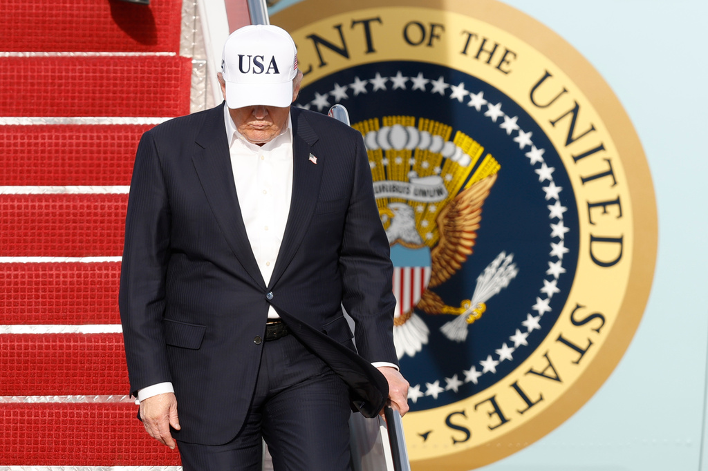 President Donald Trump walks down the stairs of Air Force One upon his arrival at Joint Base Andrews, Md., Friday, May 15, 2026. (AP Photo/Luis M. Alvarez)