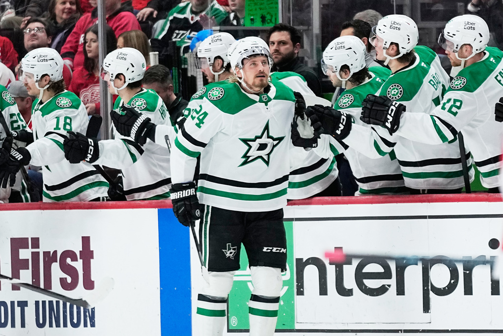 Dallas Stars center Roope Hintz celebrates with the bench after scoring during the second period of an NHL hockey game against the Detroit Red Wings Tuesday, Dec. 23, 2025, in Detroit. (AP Photo/Ryan Sun)