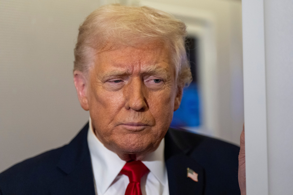 President Donald Trump speaks with reporters while in flight on Air Force One from Joint Base Andrews to his Mar-a-Lago estate in Palm Beach, Fla., Tuesday, Nov. 25, 2025. (AP Photo/Alex Brandon)