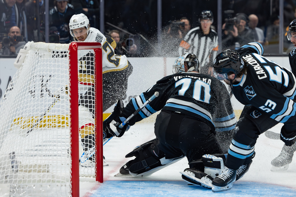Utah Mammoth goaltender Karel Vejmelka (70) blocks a shot by Vegas Golden Knights center Brett Howden (21) during the second period of Game 3 of the first round in an NHL hockey Stanley Cup playoff series, Friday, April 24, 2026, in Salt Lake City. (AP Photo/Melissa Majchrzak)