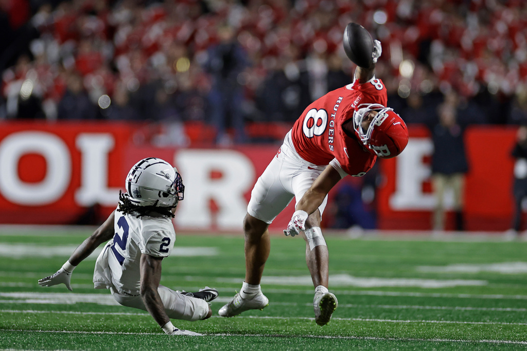 Rutgers wide receiver Kj Duff (8) makes a one-handed catch in front of Penn State cornerback Audavion Collins (2) during the second half of an NCAA college football game Saturday, Nov. 29, 2025, in Piscataway, N.J. (AP Photo/Adam Hunger)