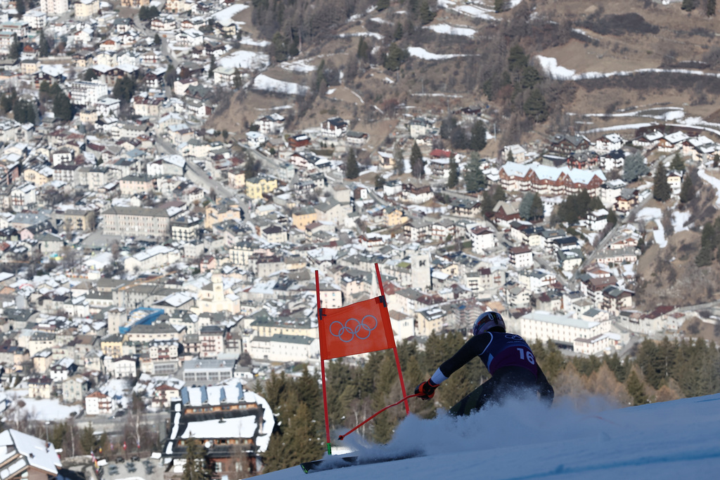 Finland's Elian Lehto speeds down the course of an alpine ski men's downhill portion of a team combined race, at the 2026 Winter Olympics, in Bormio, Italy, Monday, Feb. 9, 2026. (AP Photo/Gabriele Facciotti)