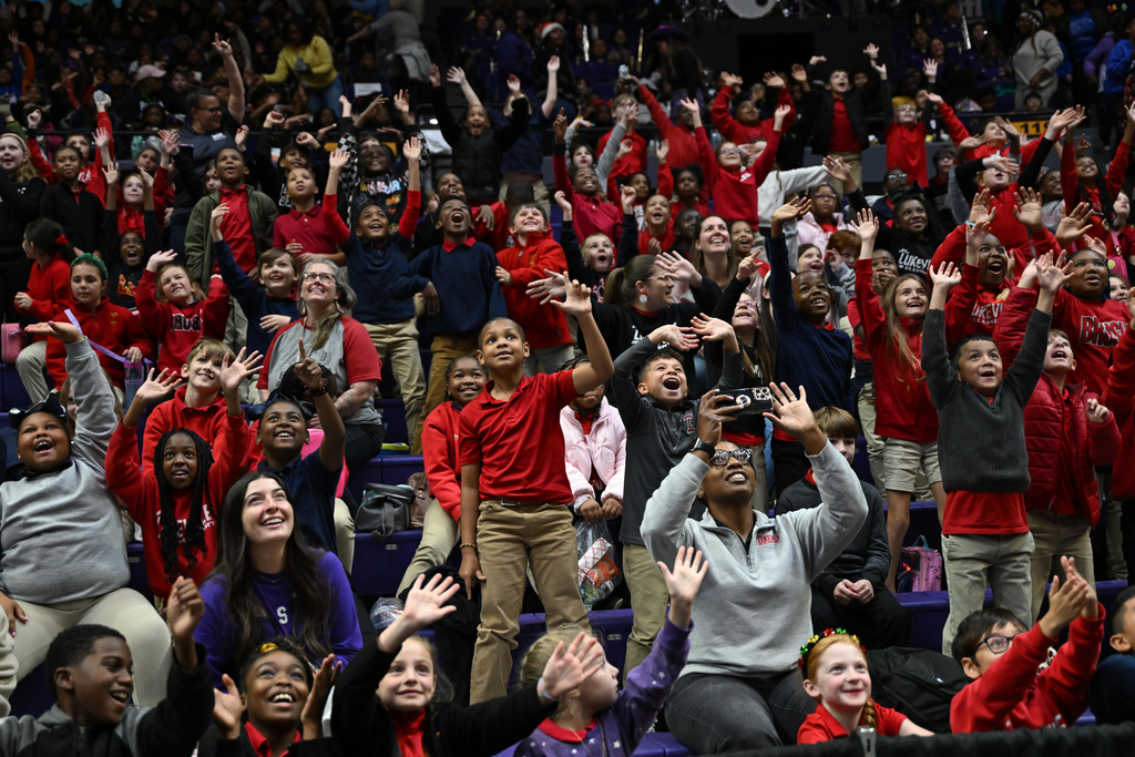 Kids from Louisiana schools' 2025 Field Trip Day watch the first half of an NCAA college basketball game between LSU and Morgan State, Tuesday, Dec. 16, 2025, in Baton Rouge. (AP Photo/Ella Hall)