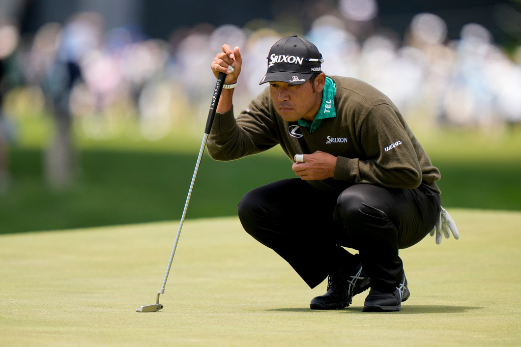 Hideki Matsuyama, of Japan, lines up his shot on the ninth green during the second round of the PGA Championship golf tournament at Aronimink Golf Club, Friday, May 15, 2026, in Newtown Square, PA. (AP Photo/Frank Franklin II)