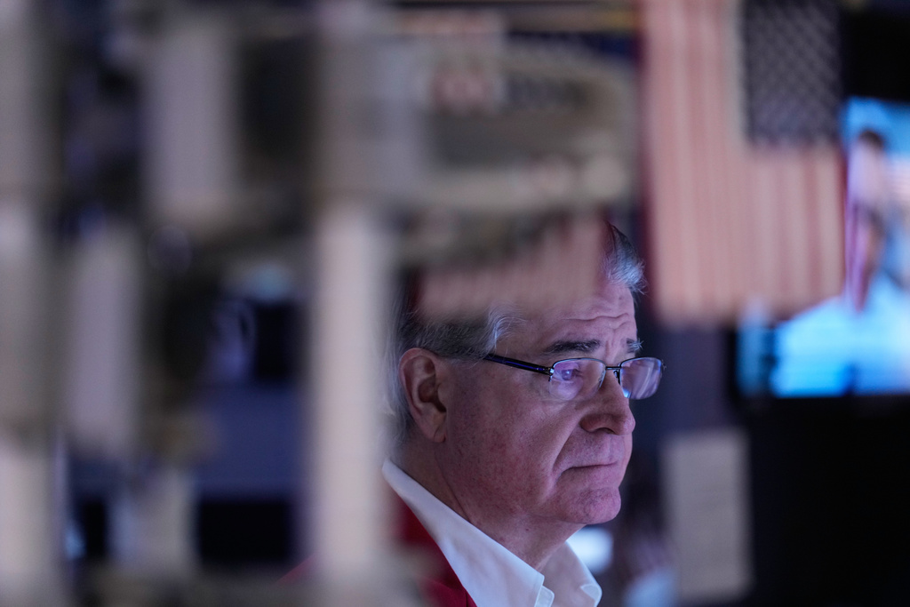 Daniel Kryger works on the floor at the New York Stock Exchange in New York, Friday, Jan. 9, 2026. (AP Photo/Seth Wenig)