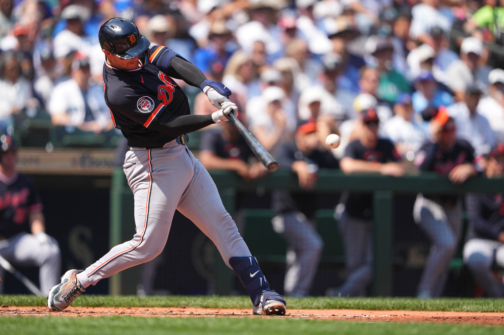 Detroit Tigers' Dillon Dingler hits an RBI single to score Kevin McGonigle against the Seattle Mariners during the second inning of a baseball game, Thursday, Aug. 6, 2026, in Seattle. (AP Photo/Lindsey Wasson)