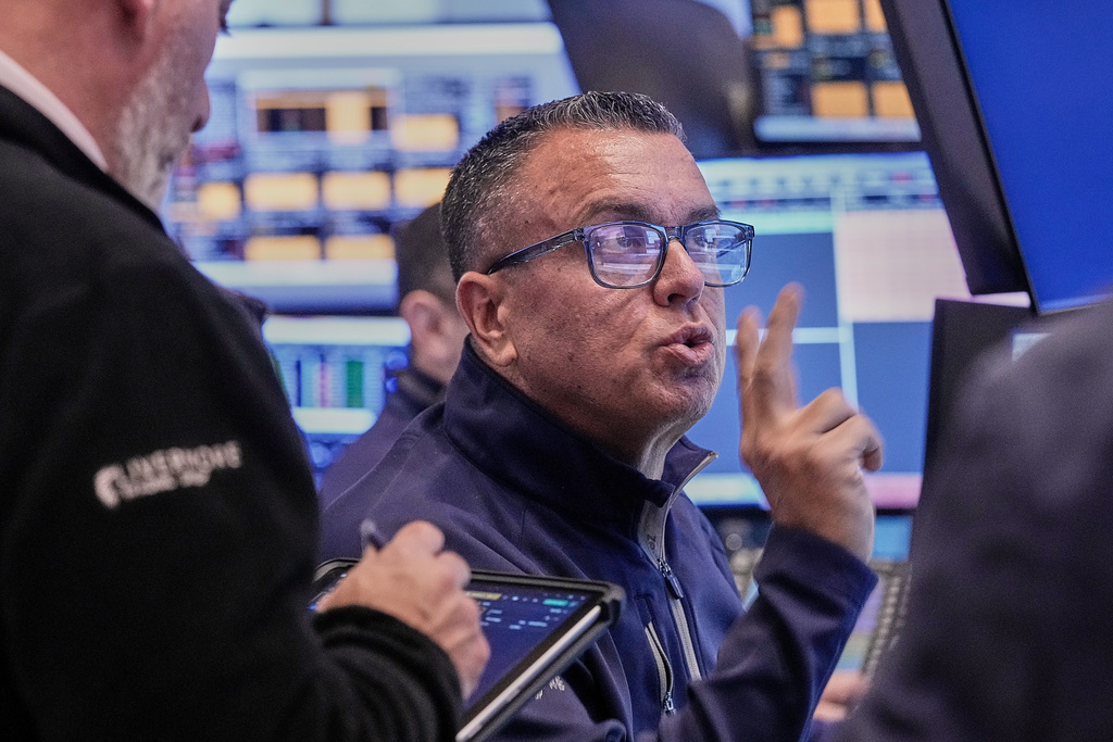Trader Robert FInnerty Jr. works on the floor of the New York Stock Exchange, Thursday, Feb. 5, 2026. (AP Photo/Richard Drew)