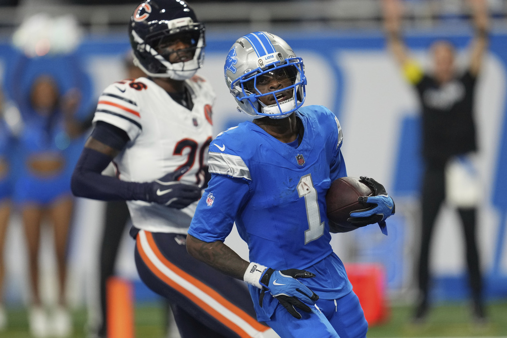 Detroit Lions wide receiver Jameson Williams (1) scores a touchdown against the Chicago Bears during the second half of an NFL football game in Detroit, Sunday, Sept. 14, 2025. (AP Photo/Paul Sancya)