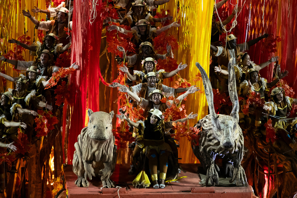 Performers from the Academicos de Niteroi samba school parade on a float during Carnival celebrations at the Sambadrome, in Rio de Janeiro, Sunday, Feb. 15, 2026. (AP Photo/Bruna Prado)