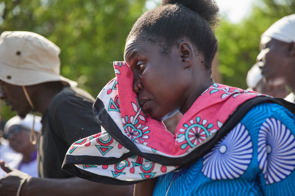 A woman cries during a funeral on the outskirts of Kisumu, Kenya, Friday, March 13, 2026. (AP Photo/Asa Wallin)