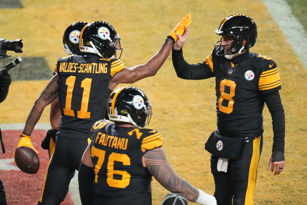 Pittsburgh Steelers' Marquez Valdes-Scantling (11), Aaron Rodgers (8) and Troy Fautanu (76) celebrate after Marquez Valdes-Scantling caught a touchdown pass in the second half of an NFL football game against the Miami Dolphins in Pittsburgh, Monday, Dec. 15, 2025. (AP Photo/Gene J. Puskar)