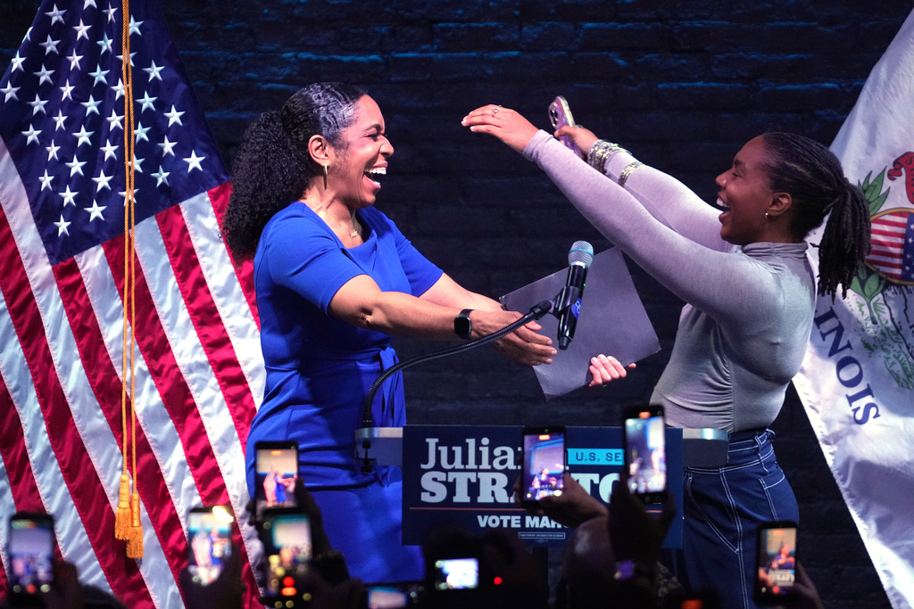 Illinois Lt. Gov. Juliana Stratton, left, hugs her daughter Cassidy during a primary election night watch party after winning the Democratic primary for U.S. Senate, Tuesday, March 17, 2026, in Chicago. (AP Photo/Erin Hooley)