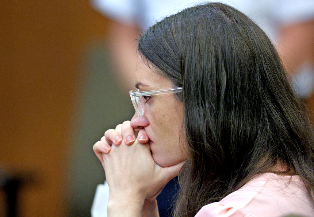 Defendant Lindsay Clancy listens to Dr. Jennifer Tufts on the witness stand during her murder trial at Plymouth Superior Court in Plymouth, Mass., Monday, Aug. 10, 2026. (Greg Derr/The Patriot Ledger via AP, Pool)