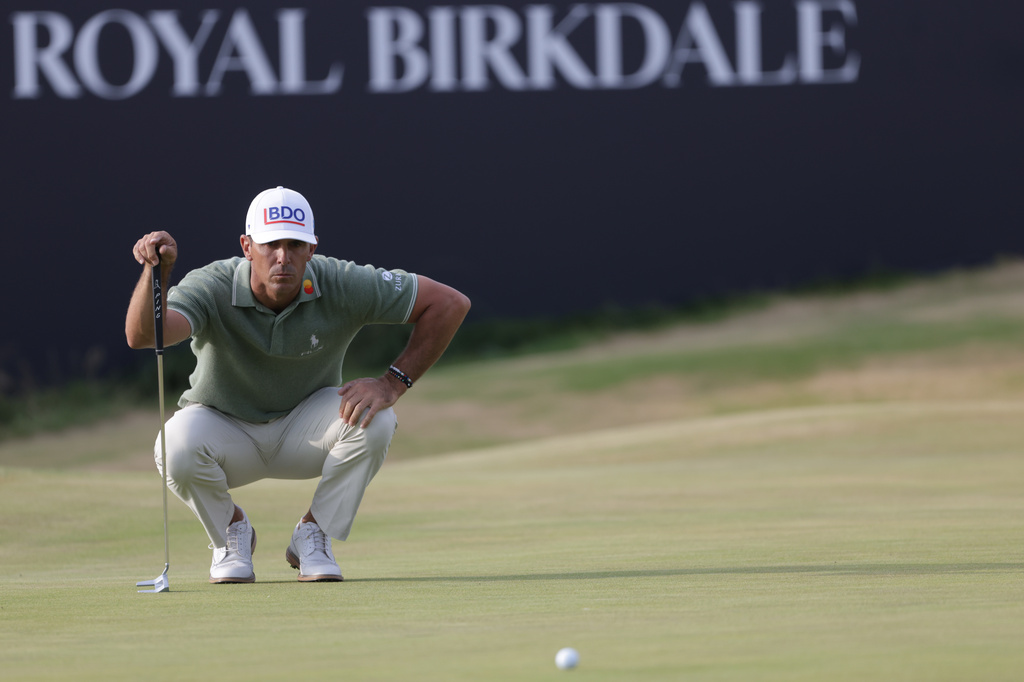 FILE - Billy Horschel of the United States looks at the lie of his putt on the 18th green during the first day of the British Open Golf championships at Royal Birkdale golf club, in Southport, England, Thursday, July 16, 2026. (AP Photo/Peter Morrison, File)