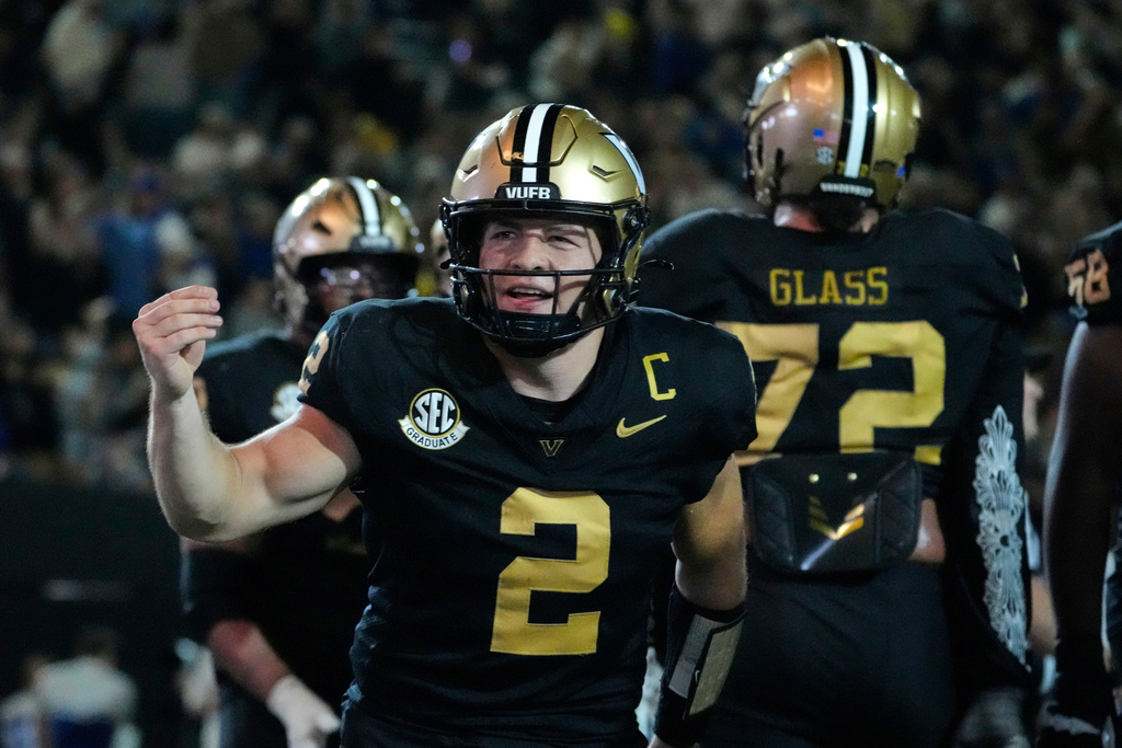 Vanderbilt quarterback Diego Pavia (2) celebrates a touchdown during the second half of an NCAA college football game against Kentucky, Saturday, Nov. 22, 2025, in Nashville, Tenn. (AP Photo/George Walker IV)