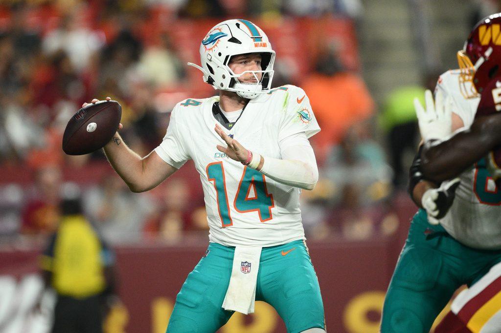 Miami Dolphins quarterback Quinn Ewers (14) aims a pass during the second half of an NFL preseason football game against the Washington Commanders, Friday, Aug. 14, 2026, in Landover, MD. (AP Photo/Nick Wass)