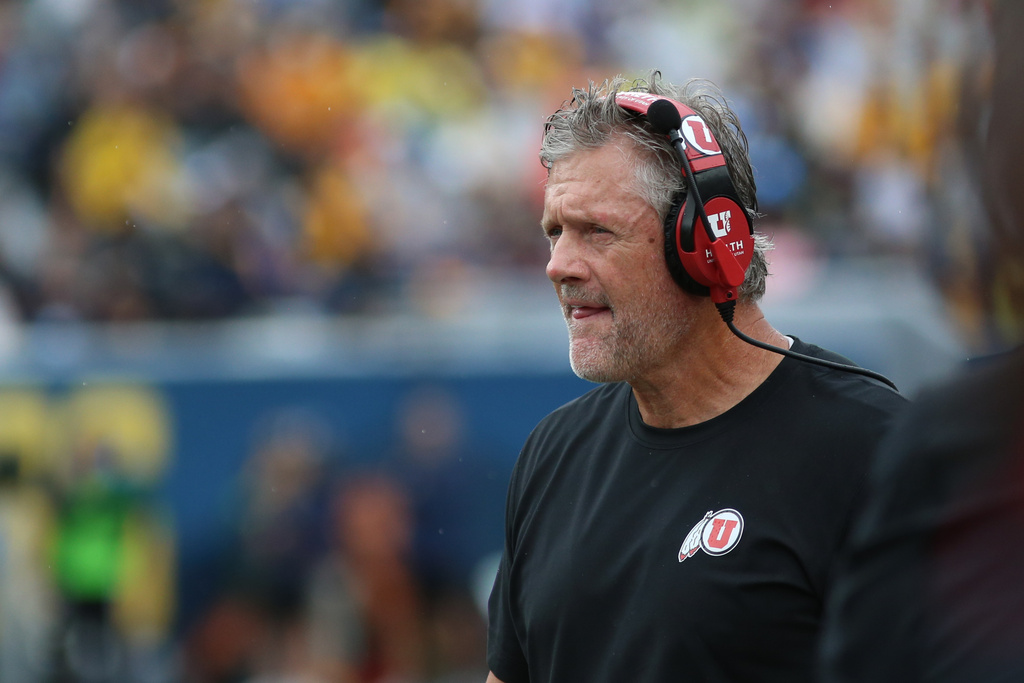 Utah Utes head coach Kyle Whittingham looks on during the first half of an NCAA college football game against West Virginia Mountaineers, Saturday, Sept, 27, 2025, in Morgantown, W.Va. (AP Photo/ William Wotring)