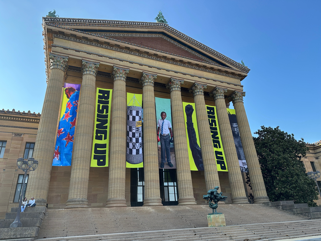 Banners for the "Rising Up: Rocky" exhibition hang outside of the Philadelphia Museum of Art in Philadelphia, Wednesday, April 22, 2026. (AP Photo/Tassanee Vejpongsa)