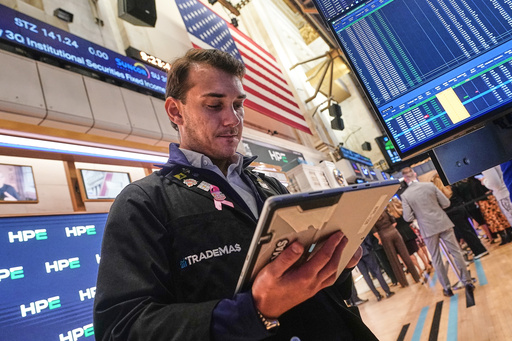 Trader Dylan Halvorsan works on the floor of the New York Stock Exchange, Wednesday, Oct. 15, 2025. (AP Photo/Richard Drew) Trader Dylan Halvorsan works on the floor of the New York Stock Exchange, Wednesday, Oct. 15, 2025. (AP Photo/Richard Drew)