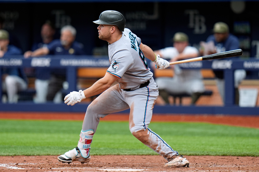 Miami Marlins' Jakob Marsee follows his single off Tampa Bay Rays pitcher Drew Rasmussen during the sixth inning of a baseball game Sunday, May 17, 2026, in St. Petersburg, Fla. (AP Photo/Chris O'Meara)