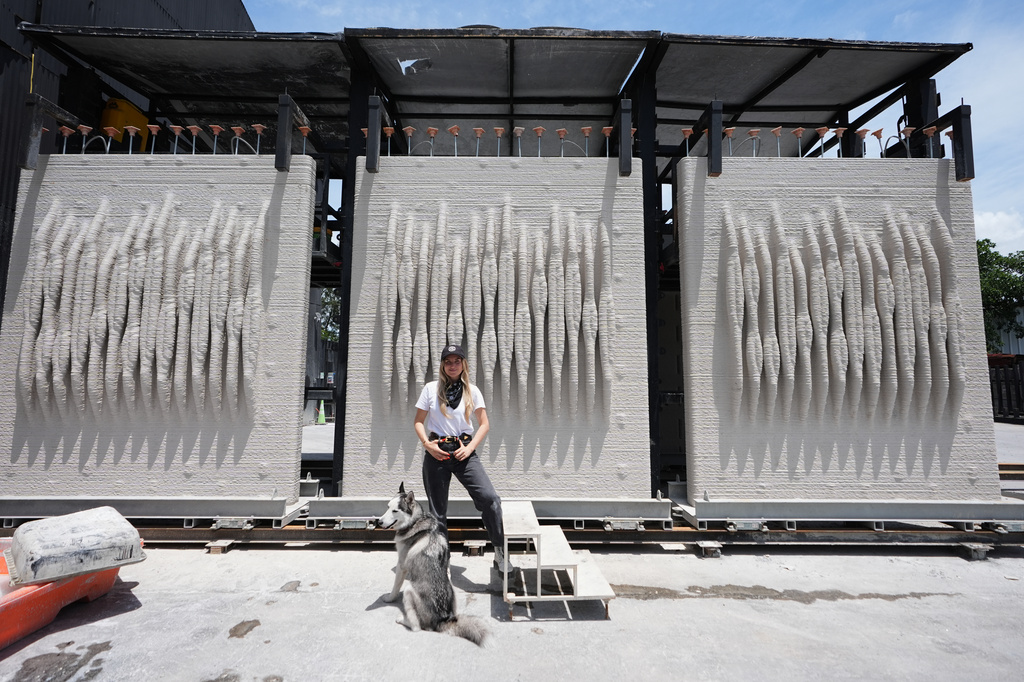 Anya Freeman, CEO and co-founder of KIND Designs, poses for a photograph with 3D-printed living seawalls Tuesday, May 12, 2026, in Miami. (AP Photo/Lynne Sladky)