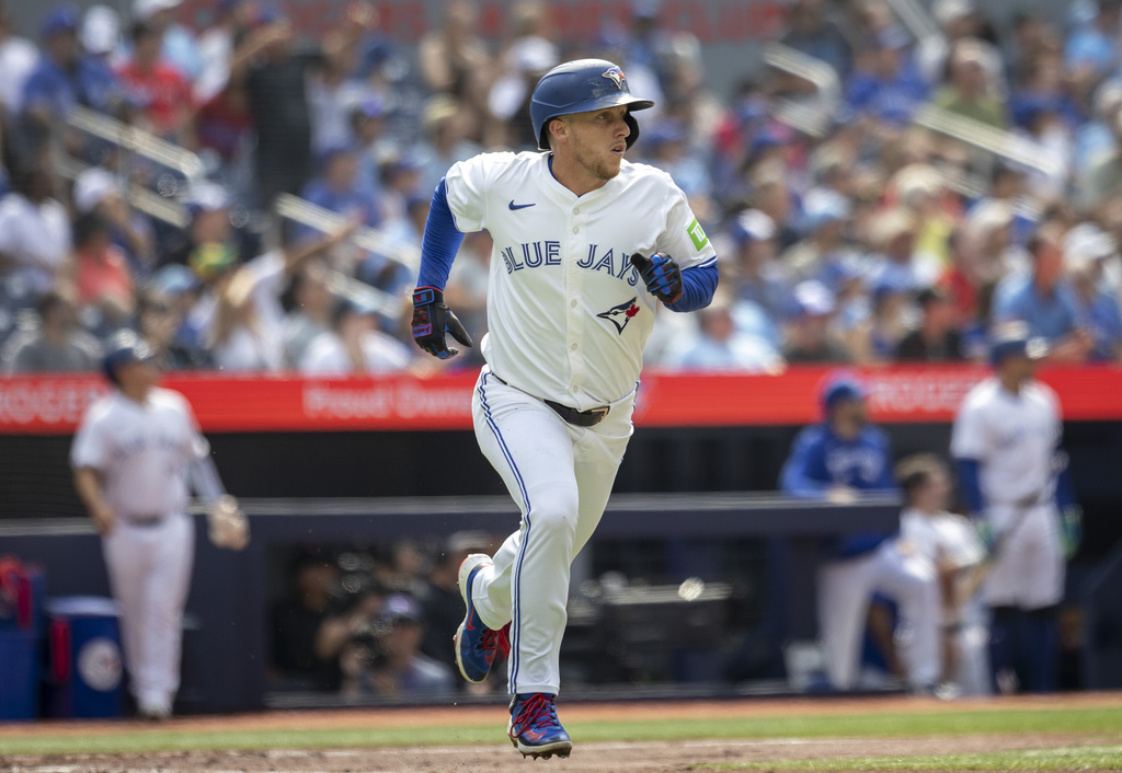 Toronto Blue Jays' Myles Straw (3) hits a home run against the Texas Rangers during the second inning of a baseball game in Toronto, Saturday, Aug. 16, 2025. (Tara Walton/The Canadian Press via AP)