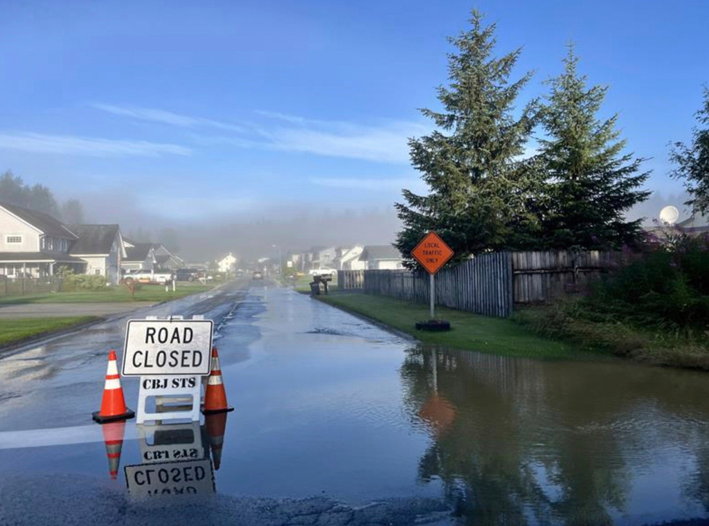 This image provided by the City and Borough of Juneau shows flooding from a release of water and snowmelt at Mendenhall Glacier covered some roads and threatened homes along the Mendenhall River in Juneau, Alaska on Wednesday, Aug. 13, 2025. (City and Borough of Juneau via AP)