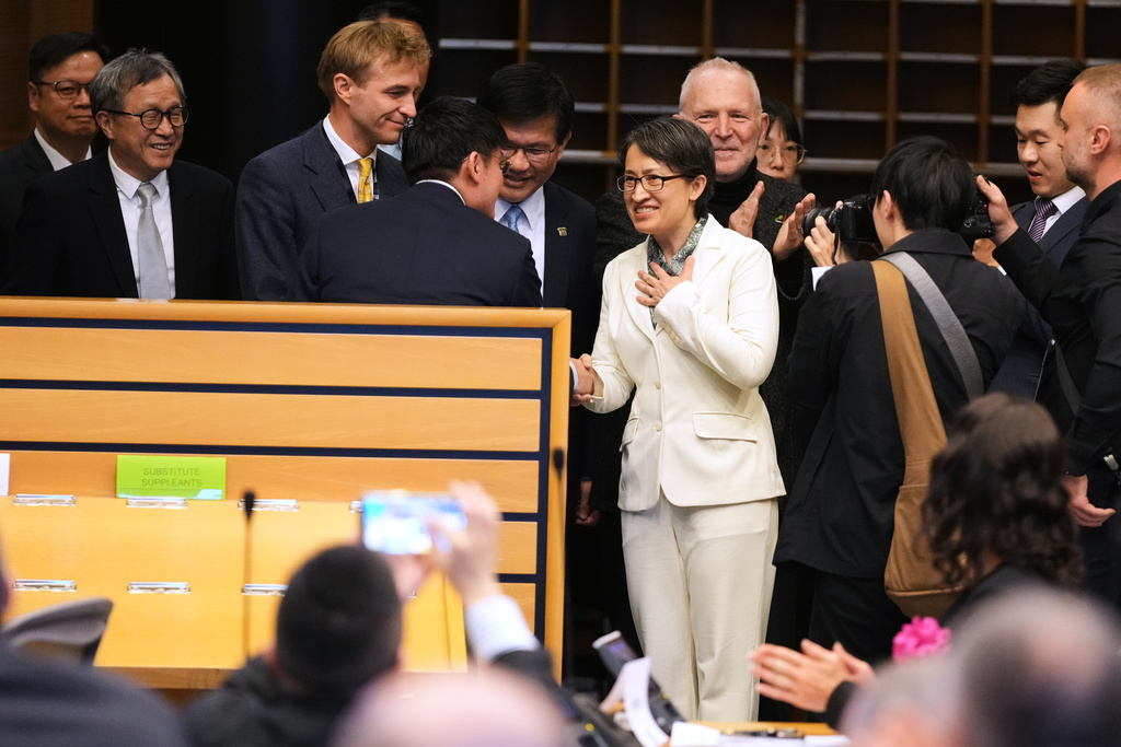 Taiwan's Vice President Bi-Khim Hsiao, center, is greeted as she arrives to address an event at the European Parliament in Brussels, Friday, Nov. 7, 2025. (AP Photo/Virginia Mayo)
