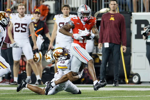 Minnesota defensive back Mike Gerald, left, tackles Ohio State receiver Carnell Tate during the first half of an NCAA college football game Saturday, Oct. 4, 2025, in Columbus, Ohio. (AP Photo/Jay LaPrete) Minnesota defensive back Mike Gerald, left, tackles Ohio State receiver Carnell Tate during the first half of an NCAA college football game Saturday, Oct. 4, 2025, in Columbus, Ohio. (AP Photo/Jay LaPrete)