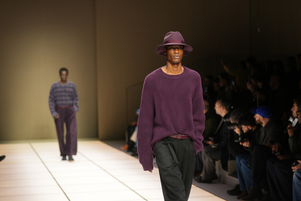 A model wears a creation as part of the Giorgio Armani Fall/Winter 2026-2027 Men's collection presented in Milan, Italy, Monday, Jan. 19, 2026. (AP Photo/Antonio Calanni)