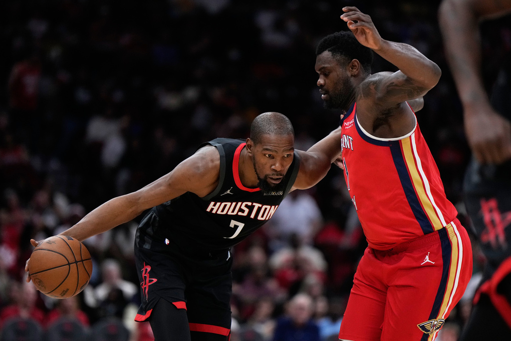 New Orleans Pelicans forward Zion Williamson (1) defends against Houston Rockets forward Kevin Durant (7) during the second half of an NBA basketball game in Houston, Friday, March 13, 2026. (AP Photo/Ashley Landis)