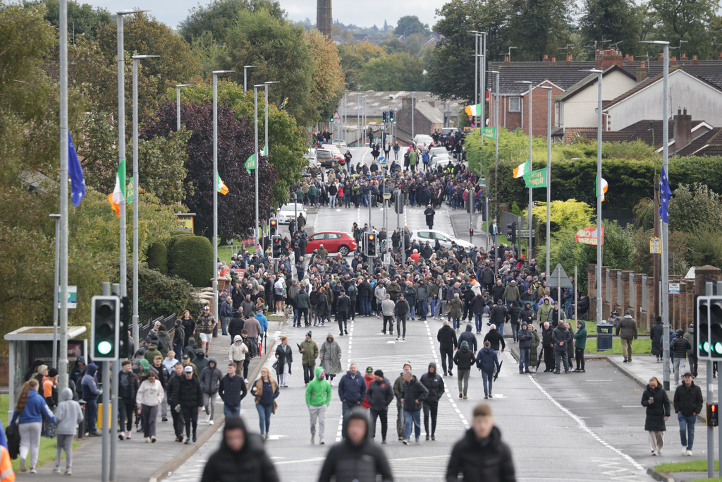Protesters block the Garvaghy road ahead of a Portadown District Loyal Orange Lodge (LOL) No 1 march in the first parade for almost 30 years, after the parade was given clearance in a late-night hearing, in Portadown, Northern Ireland, Sunday, Sept. 27, 2026. (Peter Morrison/PA via AP)