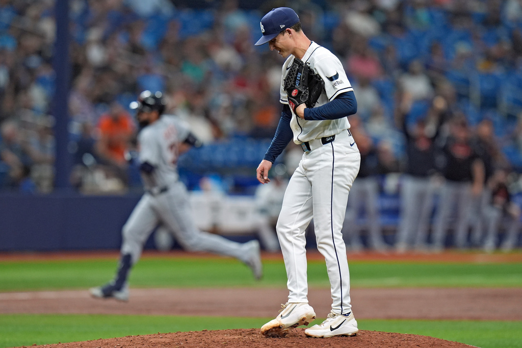 Tampa Bay Rays pitcher Griffin Jax reacts as Detroit Tigers' Riley Greene, left, runs the bases after his solo home run during the third inning of a baseball game Monday, June 1, 2026, in St. Petersburg, Fla. (AP Photo/Chris O'Meara)
