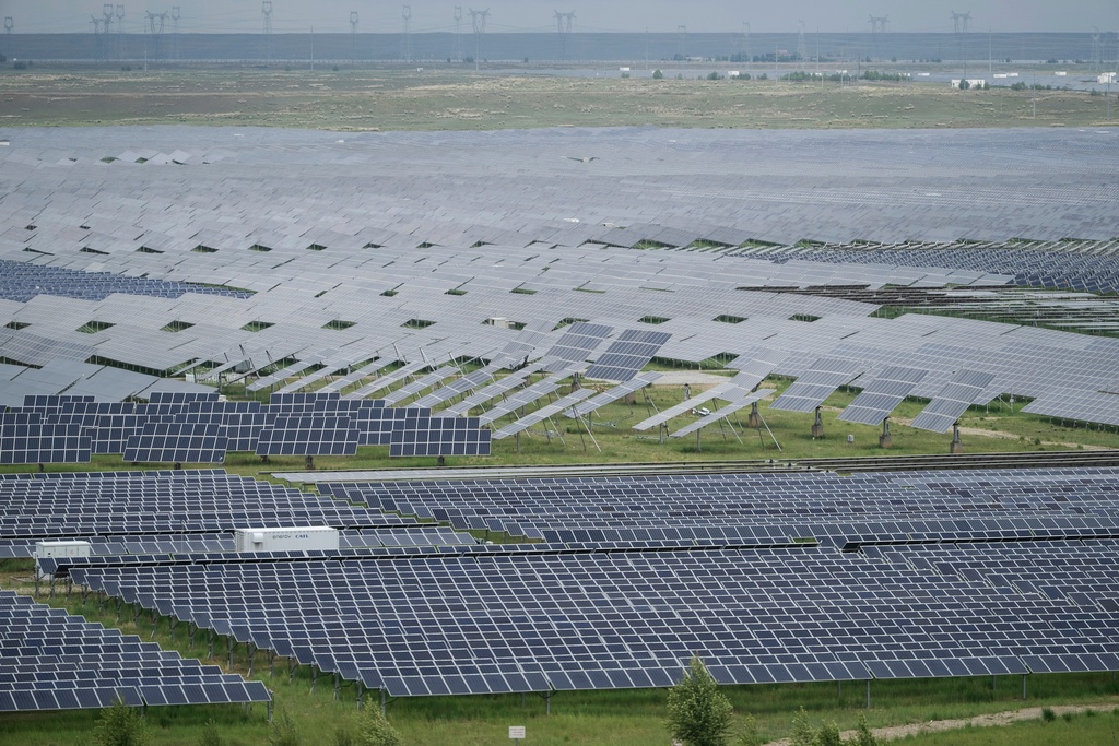 FILE - A solar farm is visible in Hainan prefecture of western China's Qinghai province July 1, 2025. (AP Photo/Ng Han Guan, File)