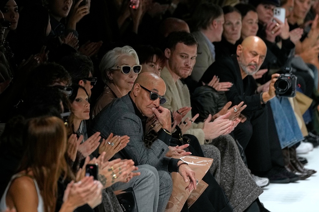 Stanley Tucci, centre left, and Meryl Streep, centre right, attend the Dolce & Gabbana Spring/Summer 2026 collection presented in Milan, Italy, Saturday, Sept. 27, 2025. (AP Photo/Luca Bruno)