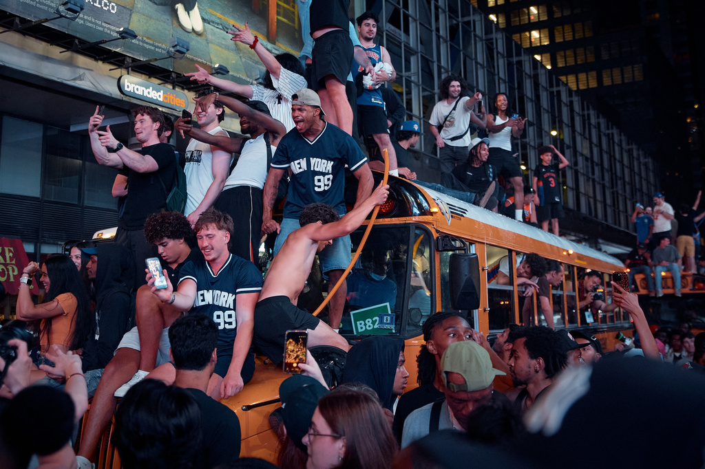 New York Knicks fans celebrate in the streets after the Knicks defeated the San Antonio Spurs to win the NBA Finals, Saturday, June 13, 2026, in New York. (AP Photo/Andres Kudacki)