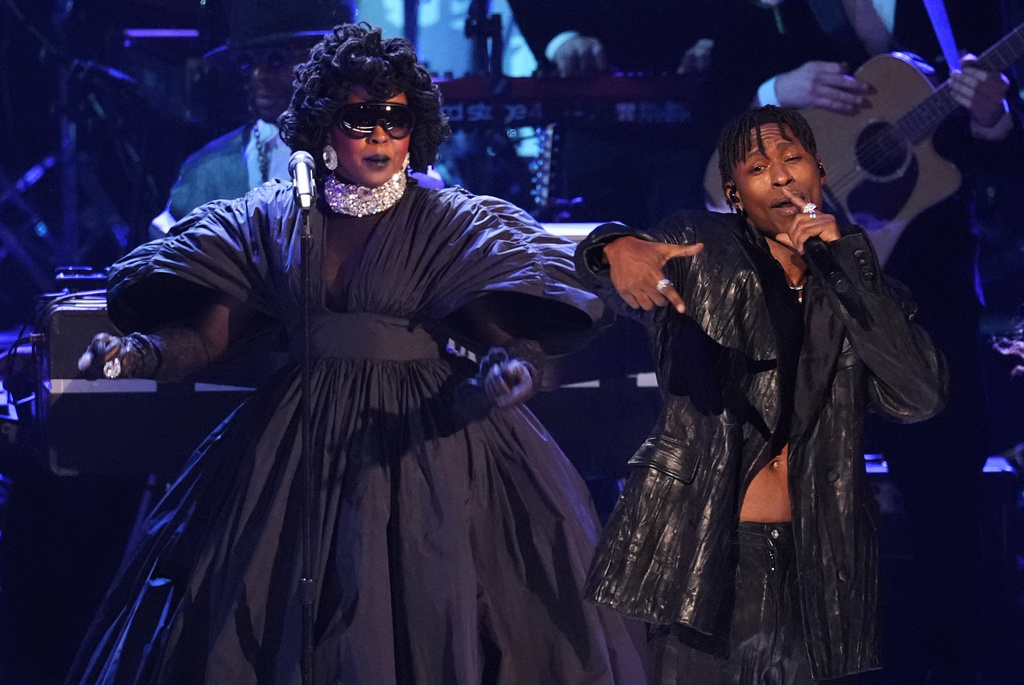 Lauryn Hill, left, and Lucky Daye perform an in memoriam tribute during the 68th annual Grammy Awards on Sunday, Feb. 1, 2026, in Los Angeles. (AP Photo/Chris Pizzello)