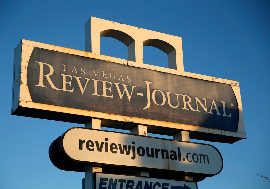 FILE - This Dec. 17, 2015 file photo shows a sign outside the building housing the Las Vegas Review-Journal in Las Vegas. AP Photo/John Locher, File)