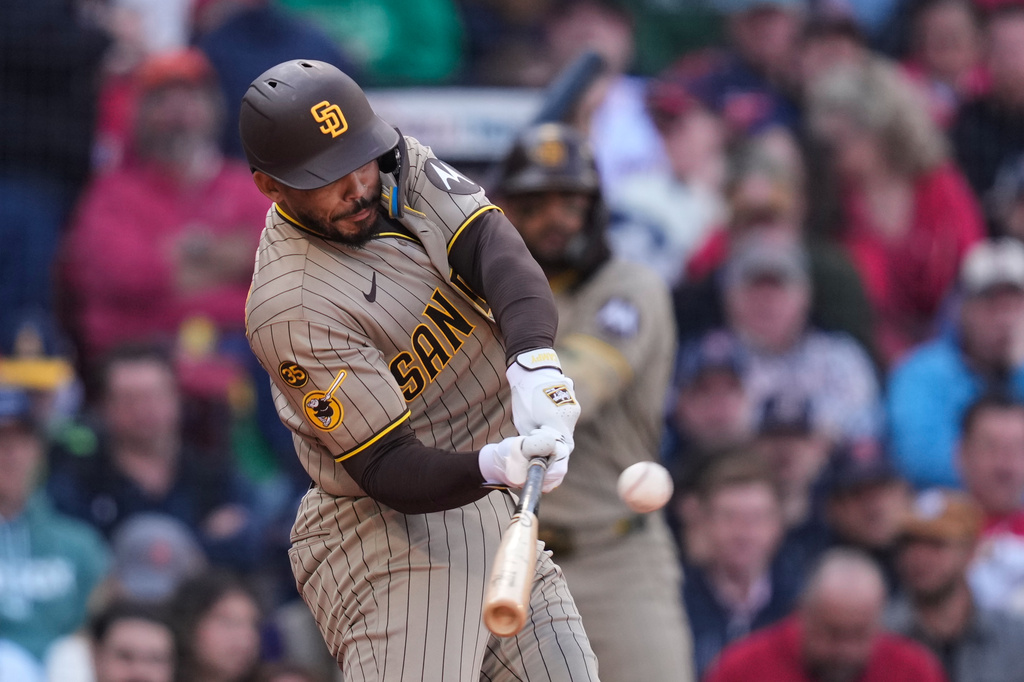 San Diego Padres' Luis Campusano hits an RBI double during the fifth inning of a home-opener baseball game against the Boston Red Sox at Fenway Park, Friday, April 3, 2026, in Boston. (AP Photo/Charles Krupa)