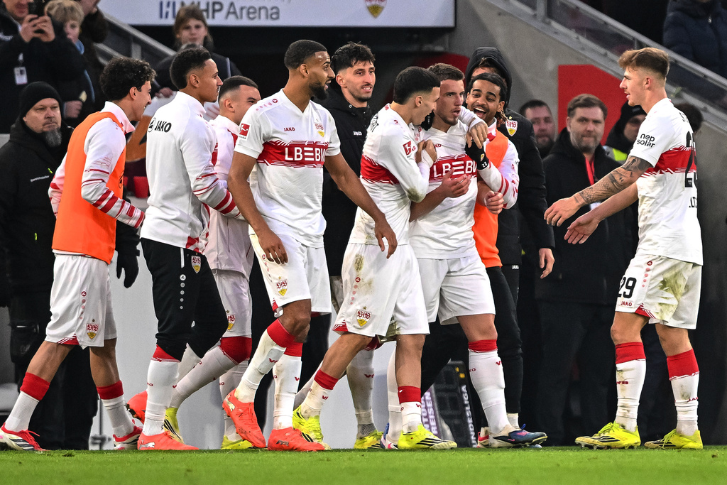 Stuttgart's scorer Ermedin Demirovic, front second right, and his teammates celebrate the opening goal during the German Bundesliga soccer match between VfB Stuttgart and SC Freiburg in Stuttgart, Germany, Sunday, Feb. 1, 2026. (Harry Langer/dpa via AP)