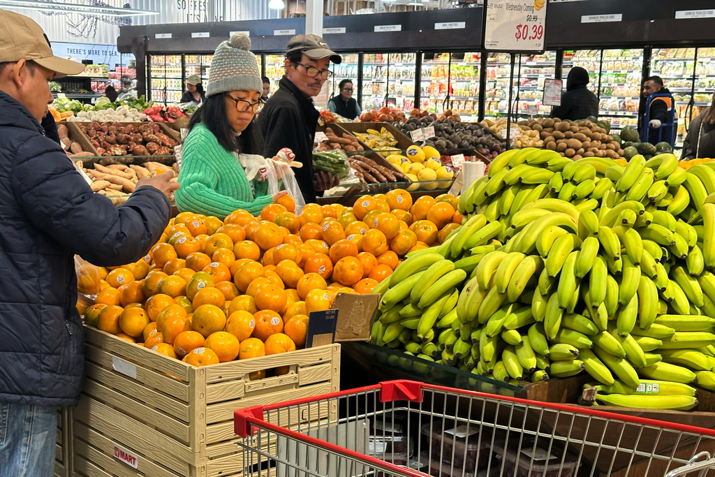 Shoppers shop at a grocery store in Schaumburg, Ill., Monday, Feb. 9, 2026. (AP Photo/Nam Y. Huh)