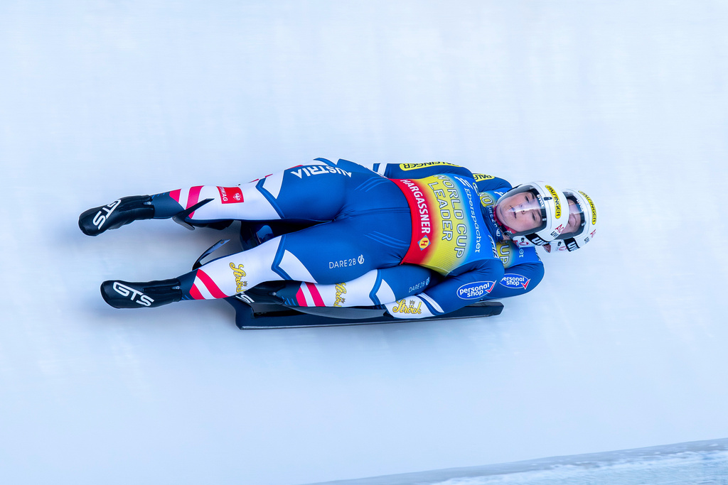 Austria's Selina Egle and Lara Michaela Kipp race through the ice channel, during the Women's doubles 1st run, at the Luge World Cup, in Winterberg, Germany, Sunday, Jan. 11, 2026. (David Inderlied/dpa via AP)