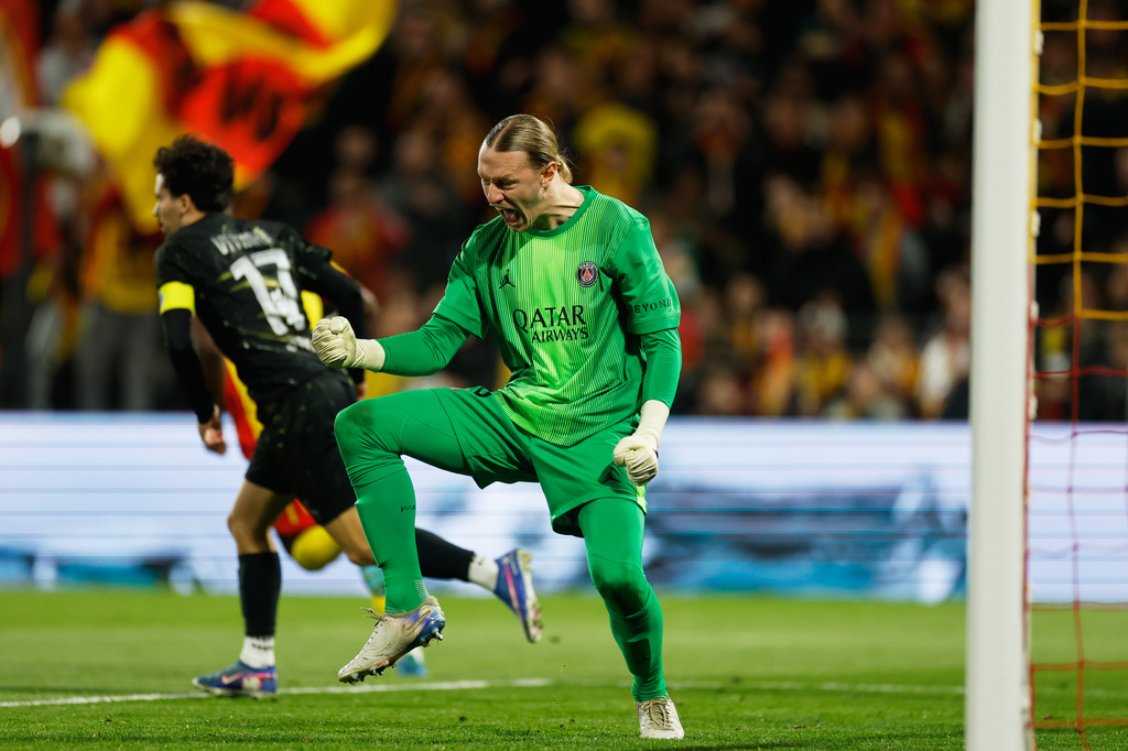 PSG's goalkeeper Matvey Safonov reacts after making a save during the French League One soccer match between Lens and Paris Saint Germain, in Lens, northern France, Wednesday, May 13, 2026. (AP Photo/Jean-Francois Badias)