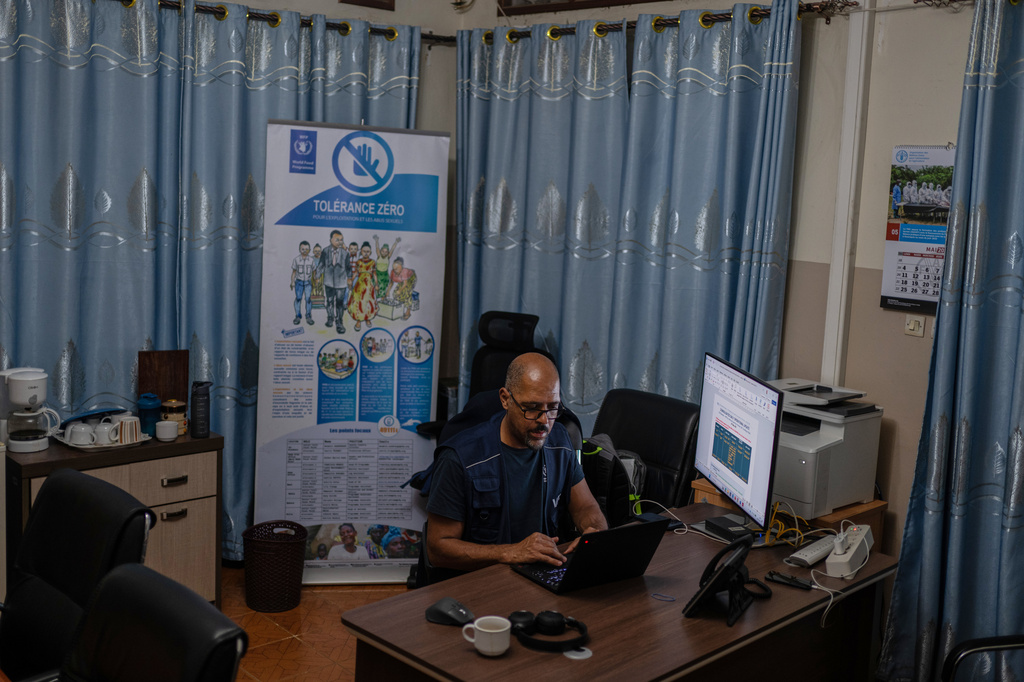 Olivier Nkakudulu, Country Director of the World Food Programme (WFP) in Ituri province, works in his office in Bunia, Congo, Monday, May 25, 2026. (AP Photo/Moses Sawasawa)