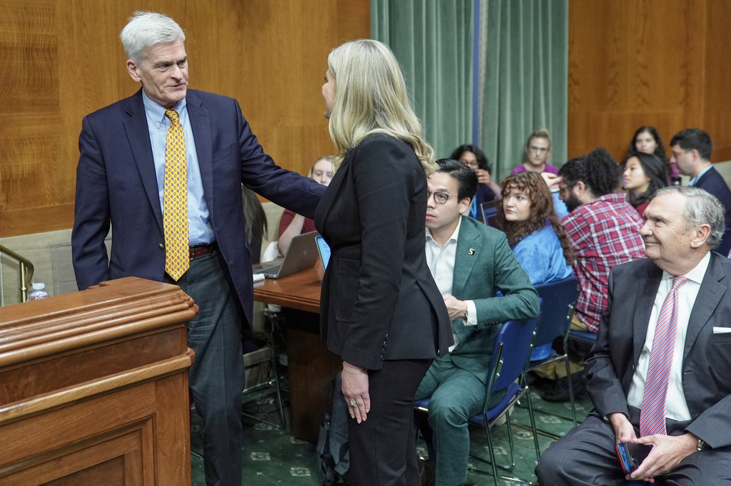 Sen. Bill Cassidy, R-La., talks with Dr. Heidi Overton before her nomination hearing to become the commissioner of Food and Drug Administration at the Senate Health, Education, Labor, and Pensions (HELP) Committee on Capitol Hill, Thursday, Sept. 24, 2026, in Washington. (AP Photo/Mariam Zuhaib)