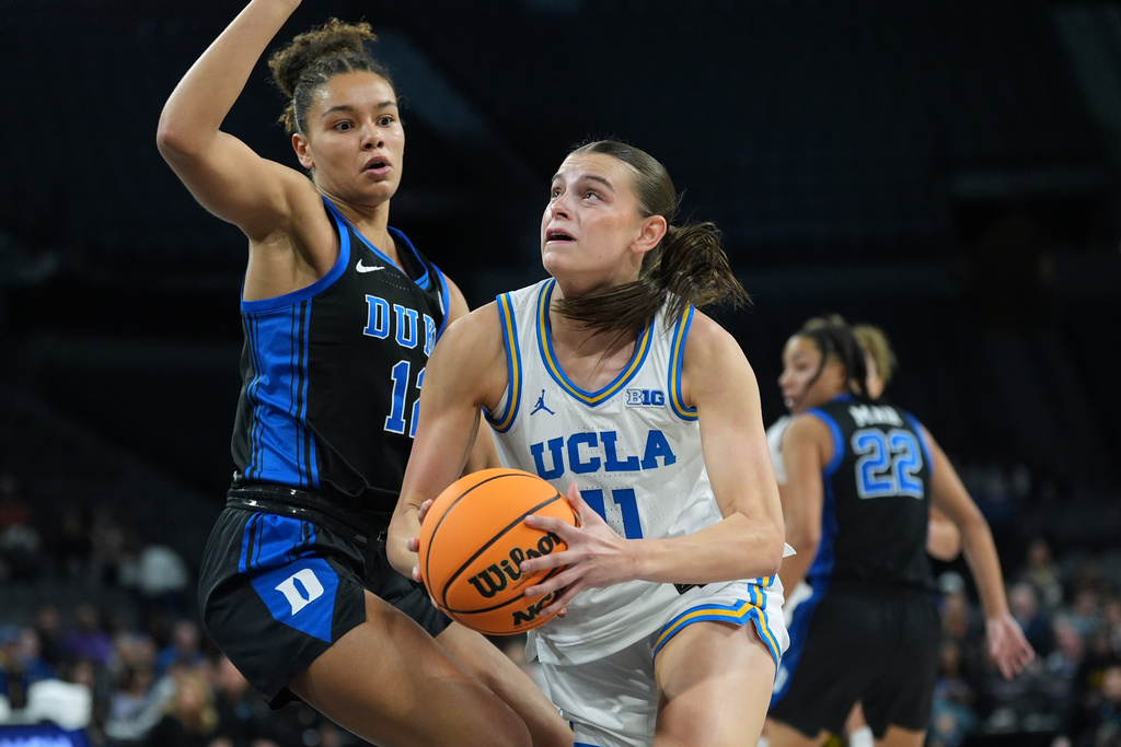 UCLA forward Gabriela Jaquez (11) drives to the basket against Duke forward Delaney Thomas (12) during the first half of an NCAA college basketball game in the Players Era tournament in Las Vegas, Thursday, Nov. 27, 2025. (AP Photo/Eric Gay)