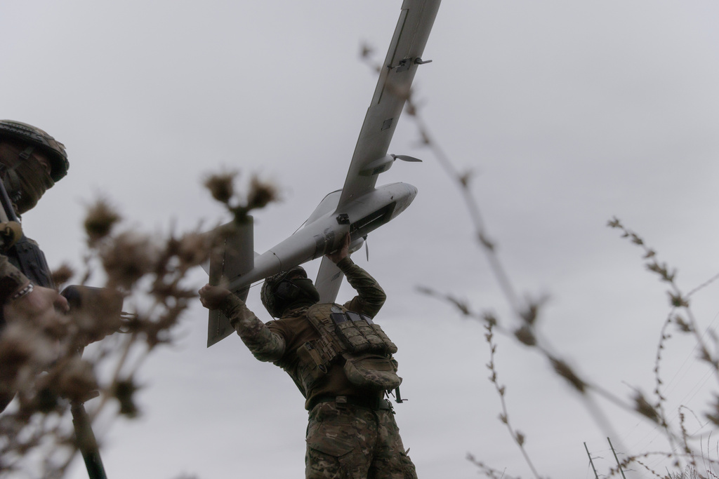 Ukrainian soldiers prepare to launch an Avenger UAV drone in Ukraine's Kharkiv region, Wednesday, Sept. 24, 2025. ( AP Photo/Yevhen Titov)