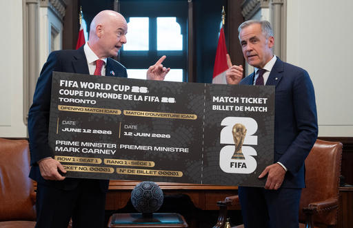 Canada Prime Minister Mark Carney, right, is presented with a novelty World Cup ticket by FIFA President Gianni Infantino on Parliament Hill in Ottawa, Ontario, Friday, Oct. 10, 2025. (Adrian Wyld/The Canadian Press via AP) Canada Prime Minister Mark Carney, right, is presented with a novelty World Cup ticket by FIFA President Gianni Infantino on Parliament Hill in Ottawa, Ontario, Friday, Oct. 10, 2025. (Adrian Wyld/The Canadian Press via AP)